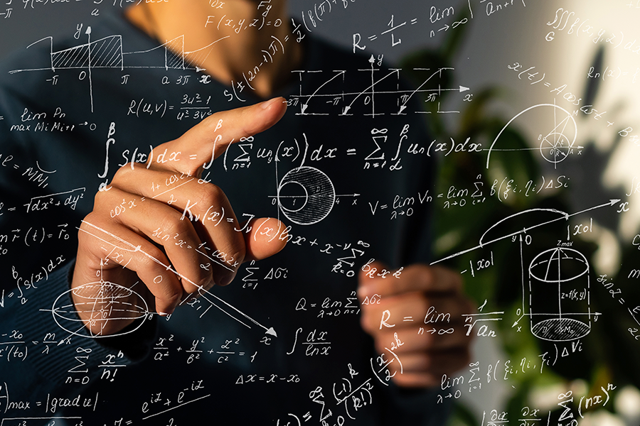 In the picture,  a person is pointing their finger at a complex overlay of white mathematical formulas and equations floating in the air.