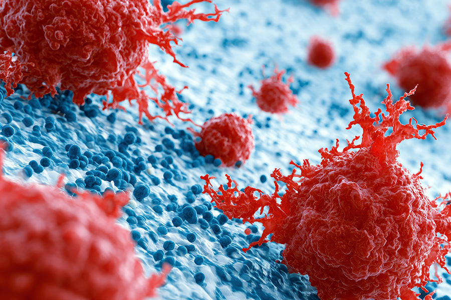 Representación en 3D de células cancerosas rojas interactuando con moléculas azules.